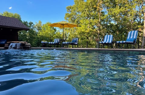 Private gunite pool with diving area and lounging furniture