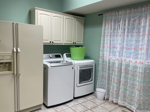 Main floor laundry with 2nd refrigerator. 3rd fridge in the pool house.