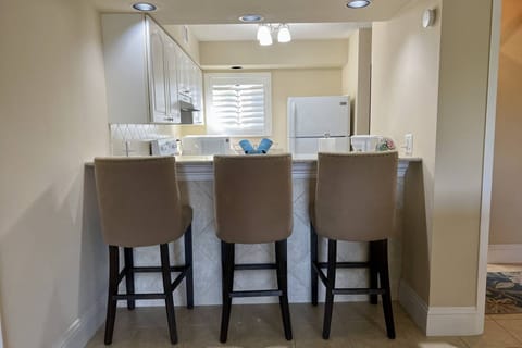 Three upholstered bar stools to enjoy dining at the bar area!