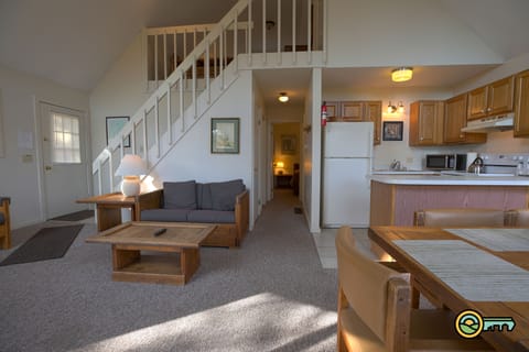 Dining room, great room, kitchen and stairs to loft