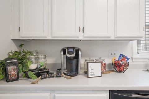 Coffee, cream, sugar, tea, and snacks