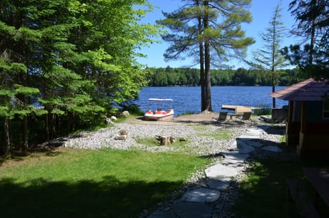 lakefront, sandy beach area & paddle boat