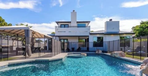 Pool is Heated Year Round with Child Proof Fence so families can relax without worries.