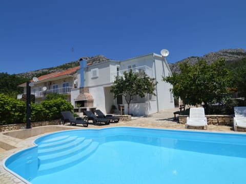 Water, Sky, Plant, Building, Azure, Natural Landscape, Tree, Body Of Water, Beach, Terrain
