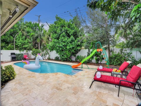 It is time to soak up the Florida sun in this private, family friendly yard complete with a pool, trampoline, lounge chairs, & a grill!