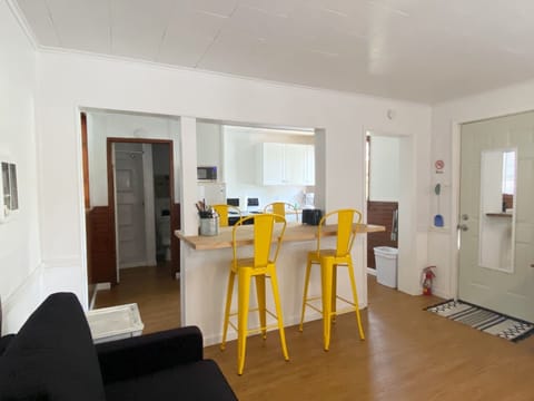 Countertop height dining chairs and bar area provide seating for 4.