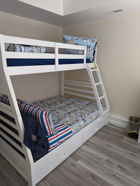 Downstairs kid bedroom with a twin over full bunk.