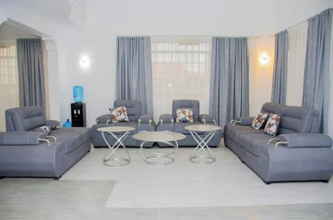 Luxurious modern open floor plan high ceiling living rm with modern chandeliers
