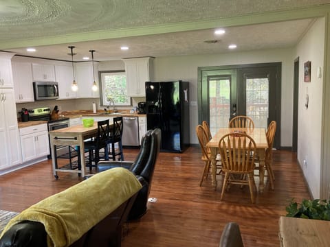 Large open space allows interaction between guests in kitchen and living room