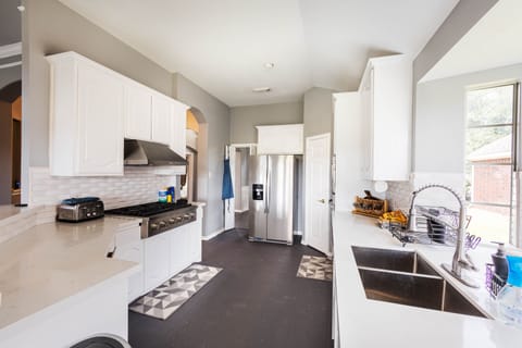 Enjoy the sleek and stylish design of our gourmet kitchen