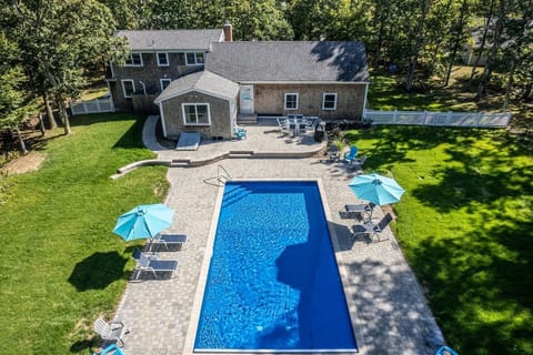 Aerial of the backside of the house and pool.