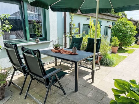 Plant, Furniture, Property, Table, Shade, Chair, Outdoor Furniture, Outdoor Table, Interior Design, Leisure