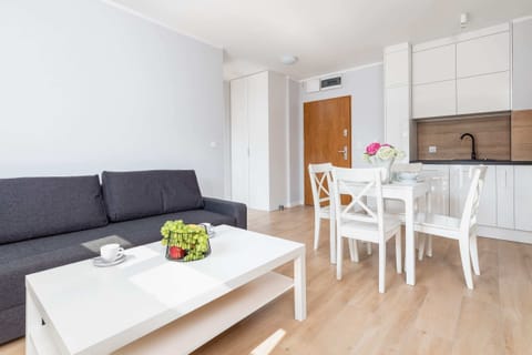 Relax in the stylish living room with a comfortable sofa and modern decor.