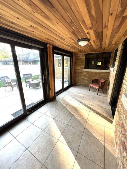 4 season room connects flexible office space and back patio