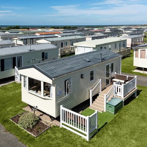Drone shot of our Caravan, Sea on the horizon, 10 mins to beach
