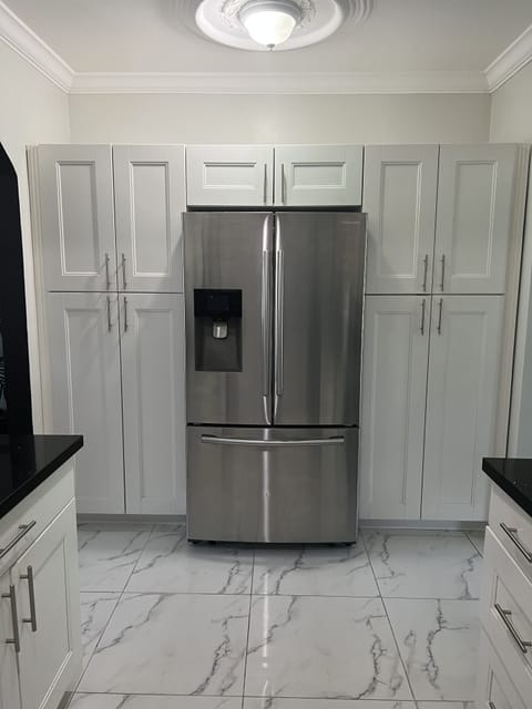 Refrigerator has filtered Ice Water maker. 