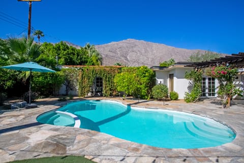 The centerpiece of the backyard is the saltwater swimming pool and attached spa.