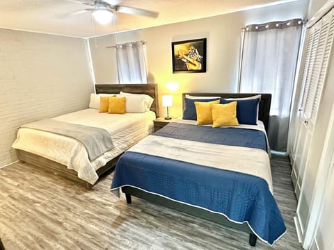 King & queen beds has night stands, lamps with USB plug, & dresser with a mirror
