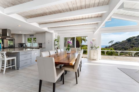 Solid wood live edge dining table for 10 with ocean views