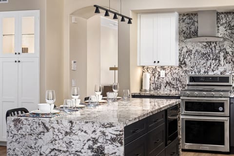 Beautiful open kitchen with stainless steel appliances.