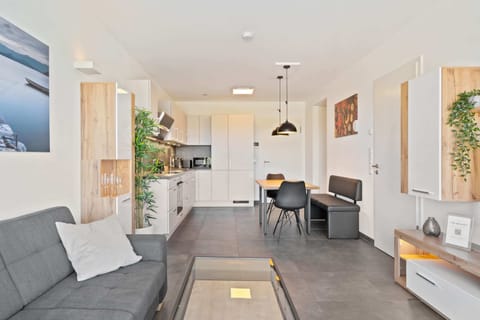 Step into your sleek home-away-from-home with a fully equipped kitchen.