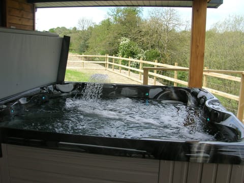 Luxury large hot tub under cover.