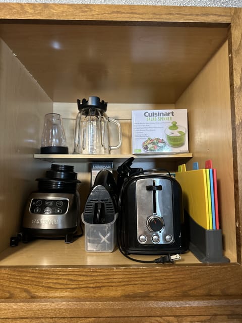 Small appliances cabinet.  There is a crock pot too.