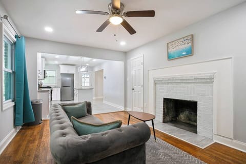 Living room with cosmetic fireplace.