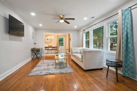 Living room number one with large bay window.