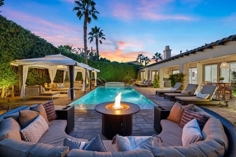 Gather around outdoor gas fire pit for cocktail hour