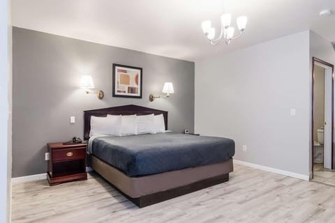 Unwind in a bright king bedroom with crisp linens.