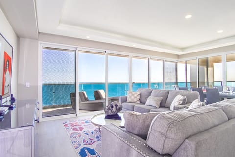 Windows bring in lots of sunlight and beach energy.