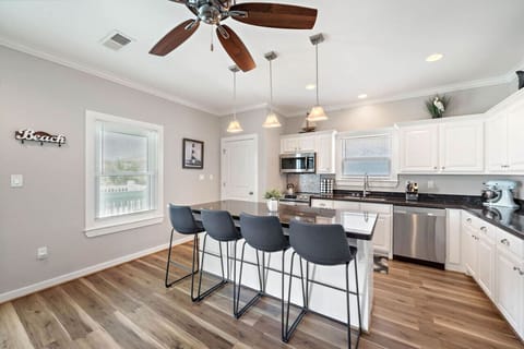 Plenty of seats and wide open kitchen to hangout while making a meal!