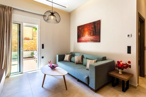 Spacious Living Room with Comfortable Sofa, Armchair, and Natural Light