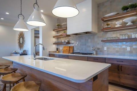 Kitchen is stocked with appliances and utensils for cooking