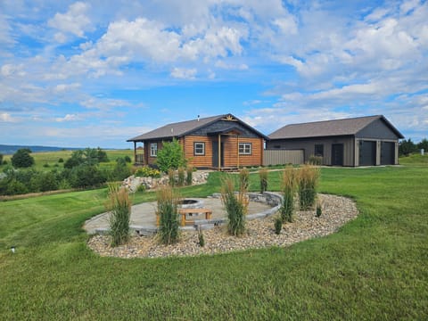 front of cabin, fireplace and garage