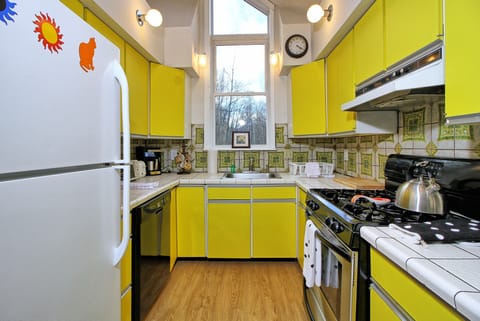 Bright and unique kitchen to make those delicious meals.  Basic pots and pans for cooking.