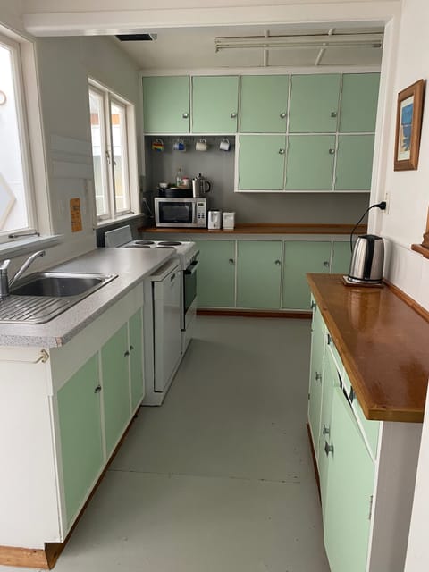 Retro kitchen with dishwasher, microwave and large french door fridge freezer