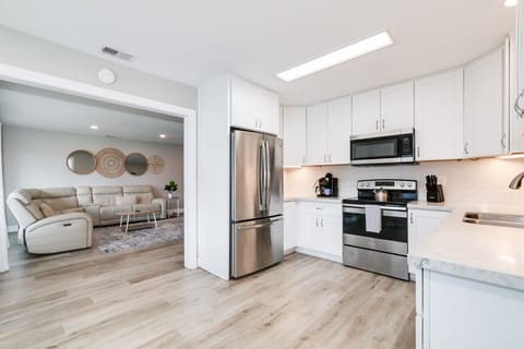 Renovated, clean and fully stocked kitchen with new appliances