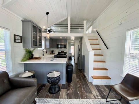 Unit 1 is a cute farmhouse style home with a nice size living room and full-size kitchen! 