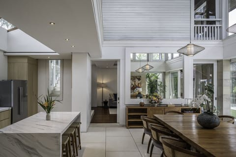 Dining room and kitchen connected to the living room all under one roof