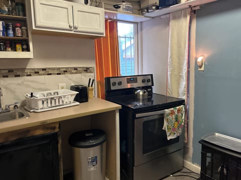 Kitchen with stove and utensils