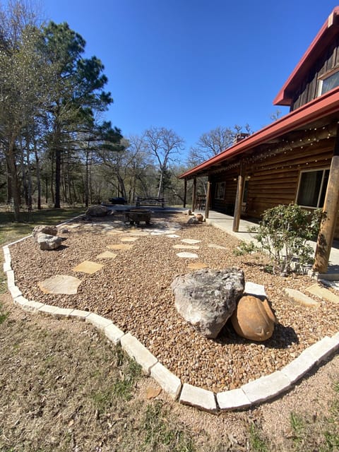Log Cabin on 5 acres with access to a shared lake. 