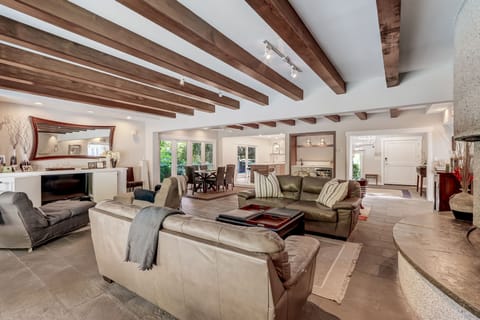 Open Concept Living Area Overlooking Private Backyard Pool