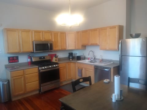 Large kitchen fully stocked with pots, pans, dishes, silverware, and glassware!