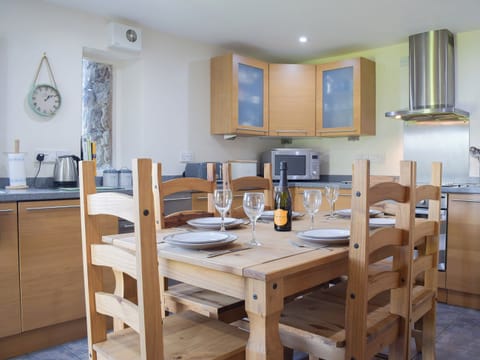 Farmhouse style dining table and chairs in the kitchen | Carmarthen Cottages- Barn Cottage - Carmarthen Cottages, Cwmdu, Near Llandeilo