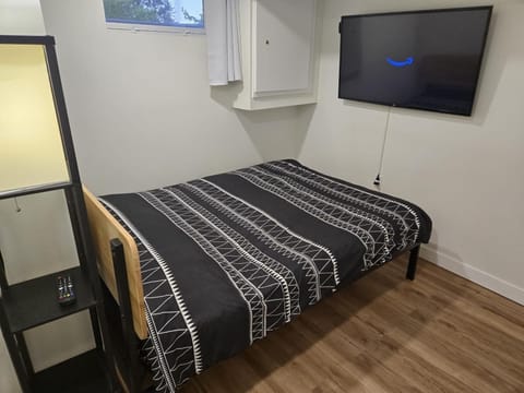 Queen size Euro top mattress with a 50 inch SmartTV with Netflix and Prime