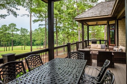 Relax on the back deck with scenic views of Forest Creek GC!