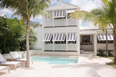 Exterior of Main House "Conch Shell House" - view of pool and yard.
