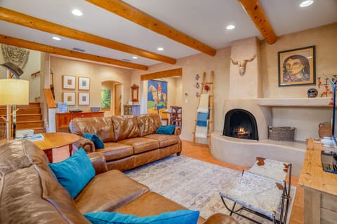 Living area with Kiva fireplace and banco